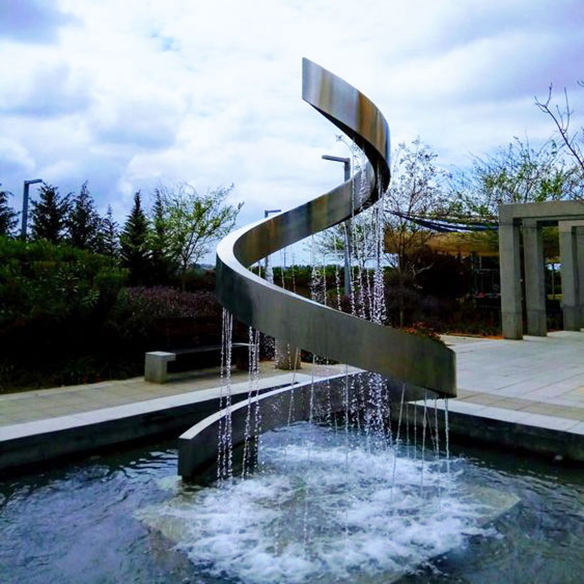 Stainless steel water feature sculpture with flowing design