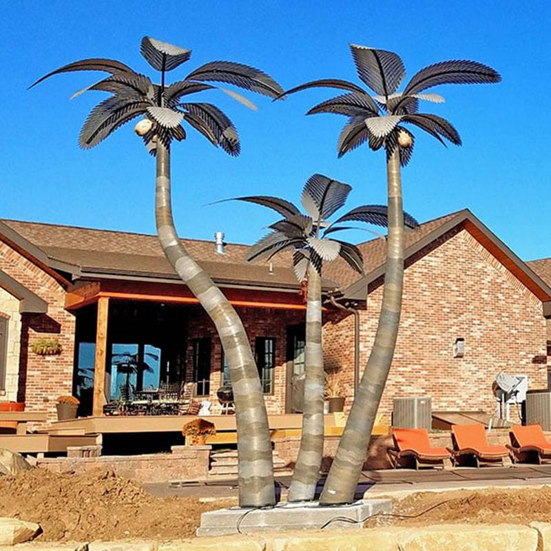metal palm tree sculpture in front of house