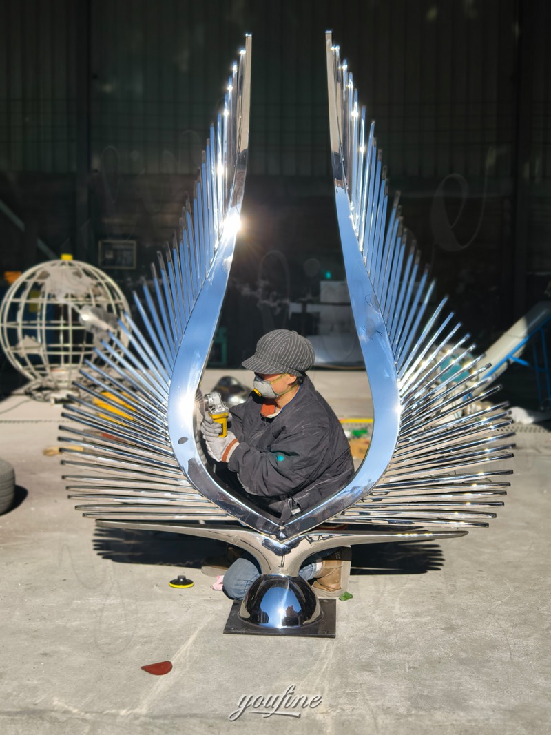 abstract wing sculpture polishing