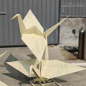 large metal paper crane sculpture