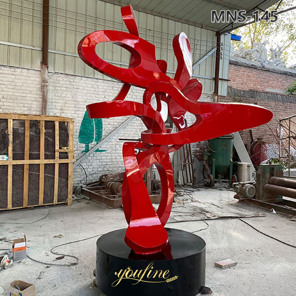side view of red abstract sculpture