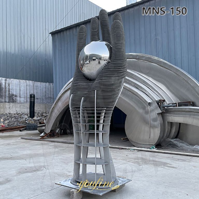 large hand sculpture art