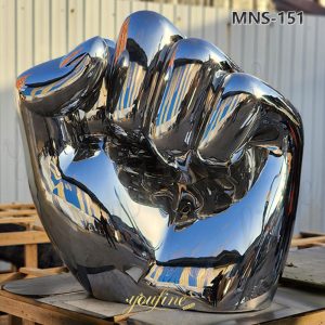large metal fist sculpture