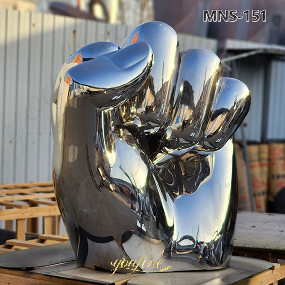large stainless steel fist sculpture
