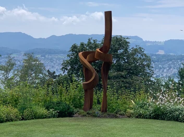 Large Corten steel abstract sculpture installed at a garden in Sweden