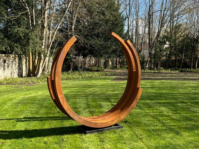 corten steel sculpture install in France Garden