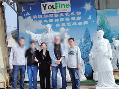 Middle East client posing with completed marble sculpture at YouFine studio