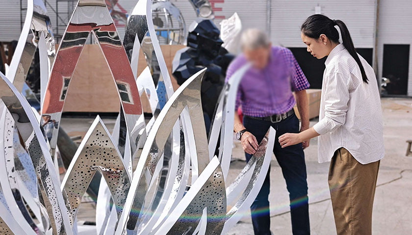American clients touring the YouFine stainless steel sculpture workshop in Quyang