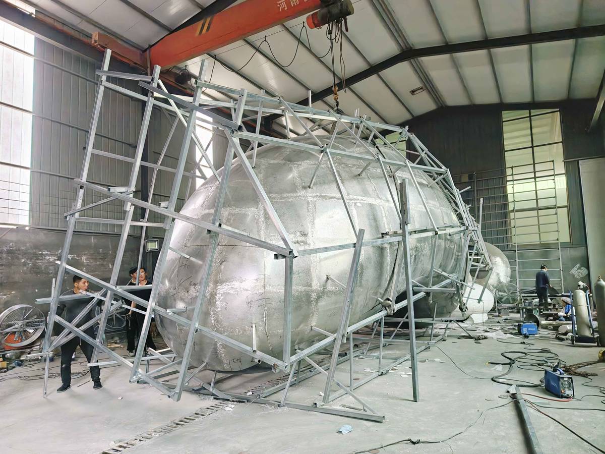 Large stainless steel sculpture fabrication process inside the YouFine workshop