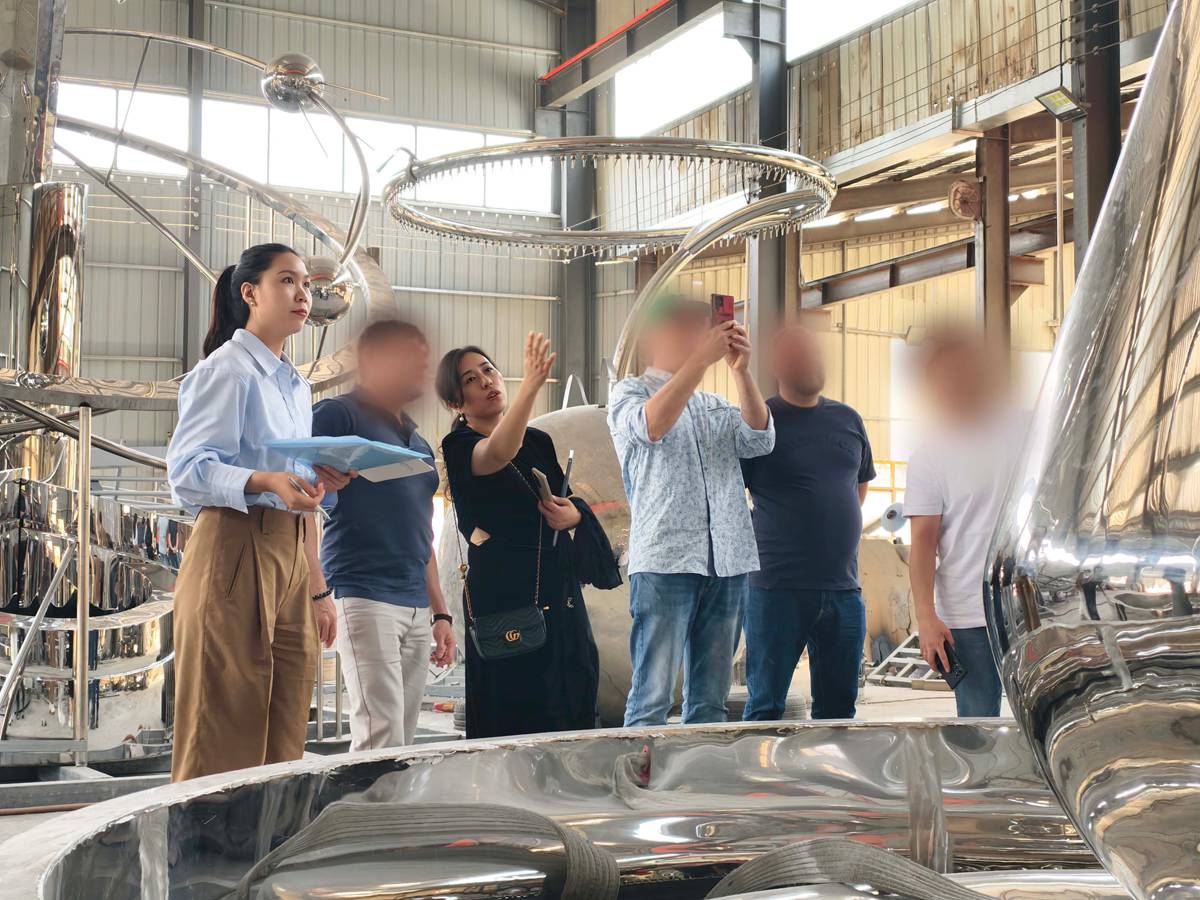 Moscow park project client inspecting sculptures at YouFine factory